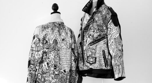 Two detailed jackets, covered with black and white drawings