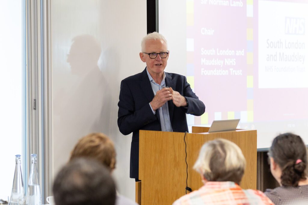 Sir Norman Lamb speaking at a lecturn