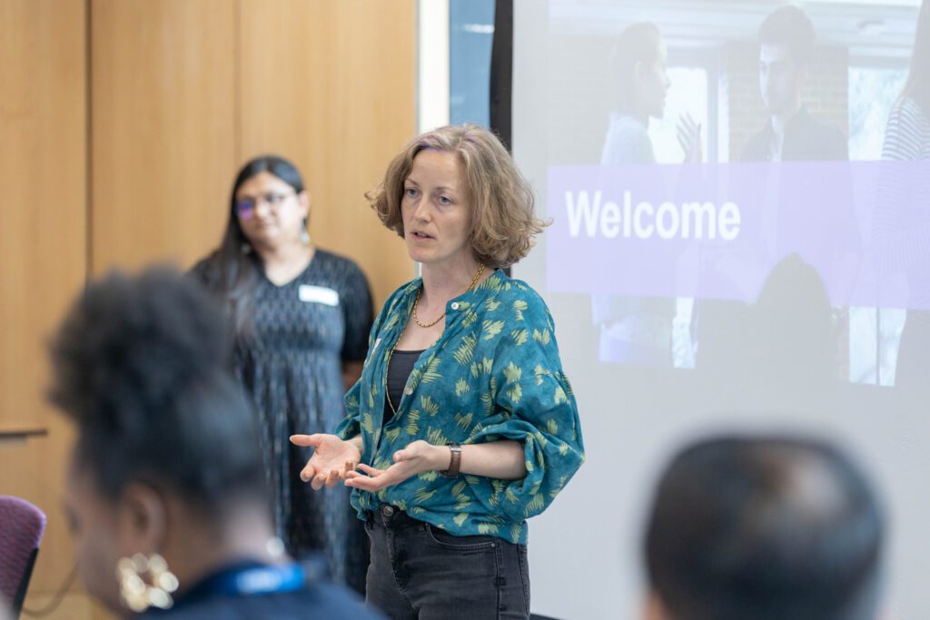 Alice Casey speaking to a room of people