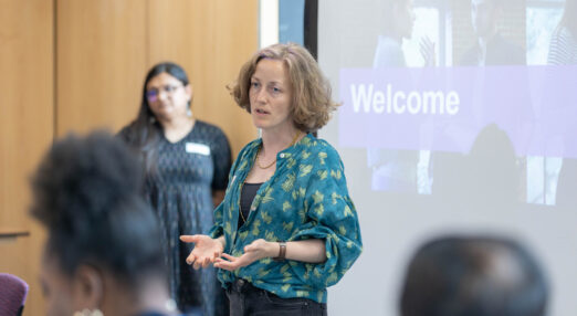 Alice Casey speaking to a room of people