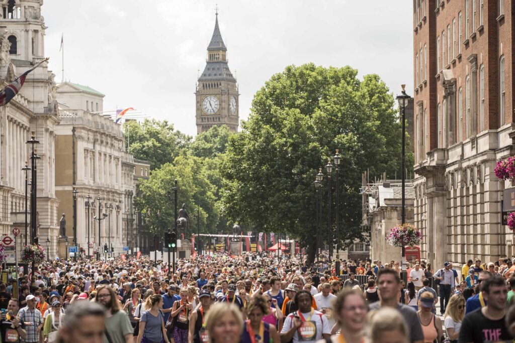 A mass of runners in London, with the Houses of Parliament in the background