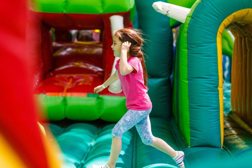 A child running along an inflatable structure