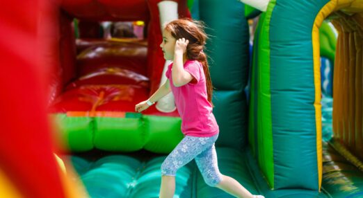 A child running along an inflatable structure